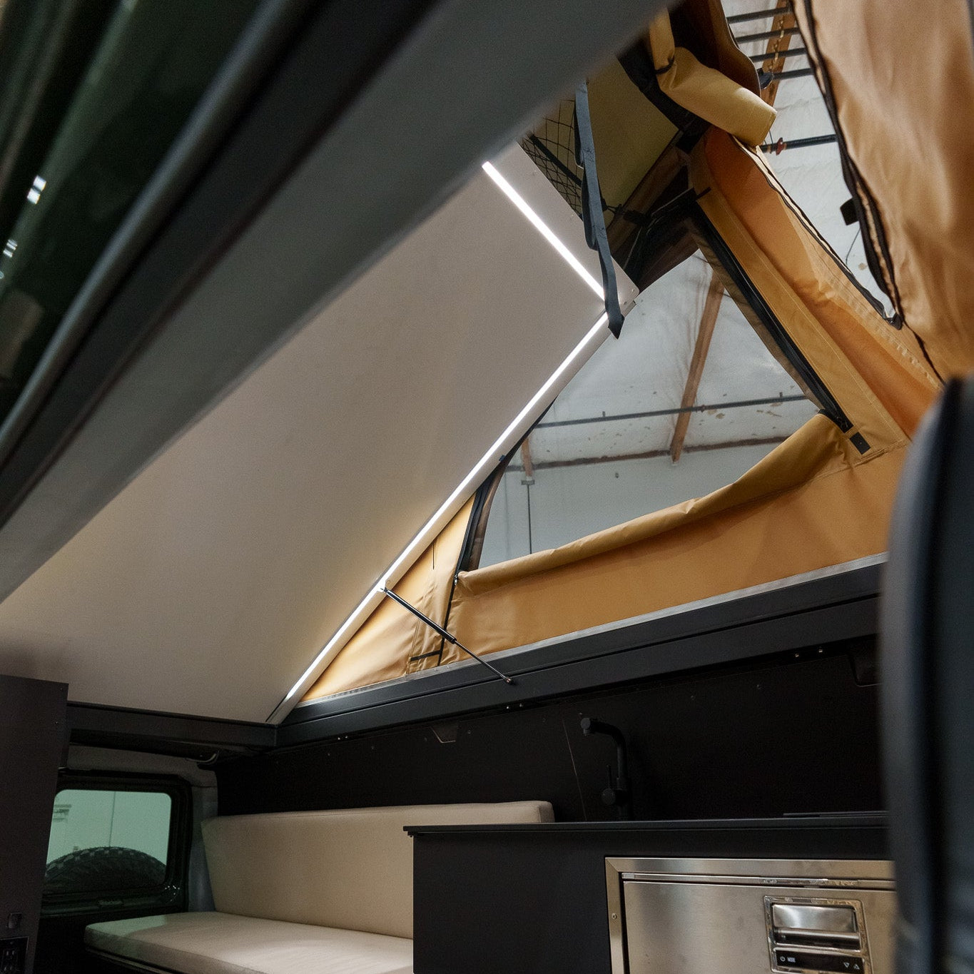 Interior of a Ford E-Series with a Cloud Cap Bed