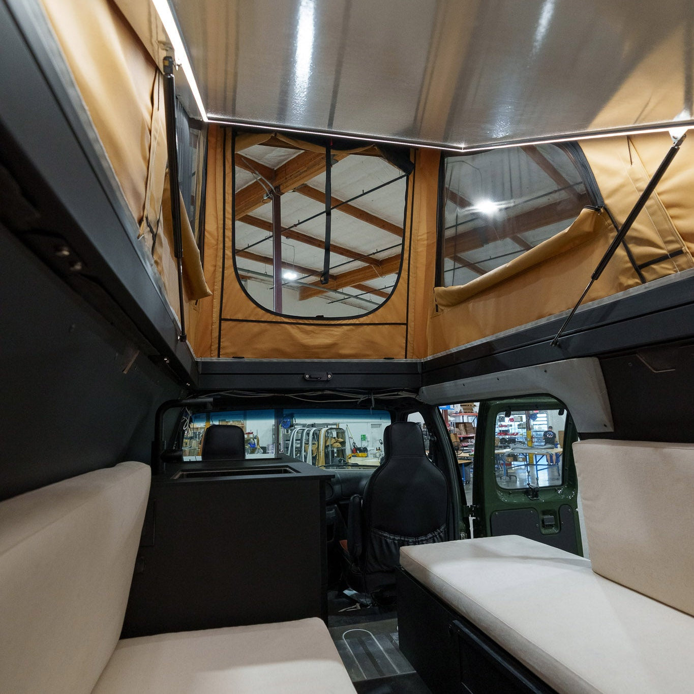 Interior of a Cloud Cap Super Pacific with beige seating and a reflective ceiling