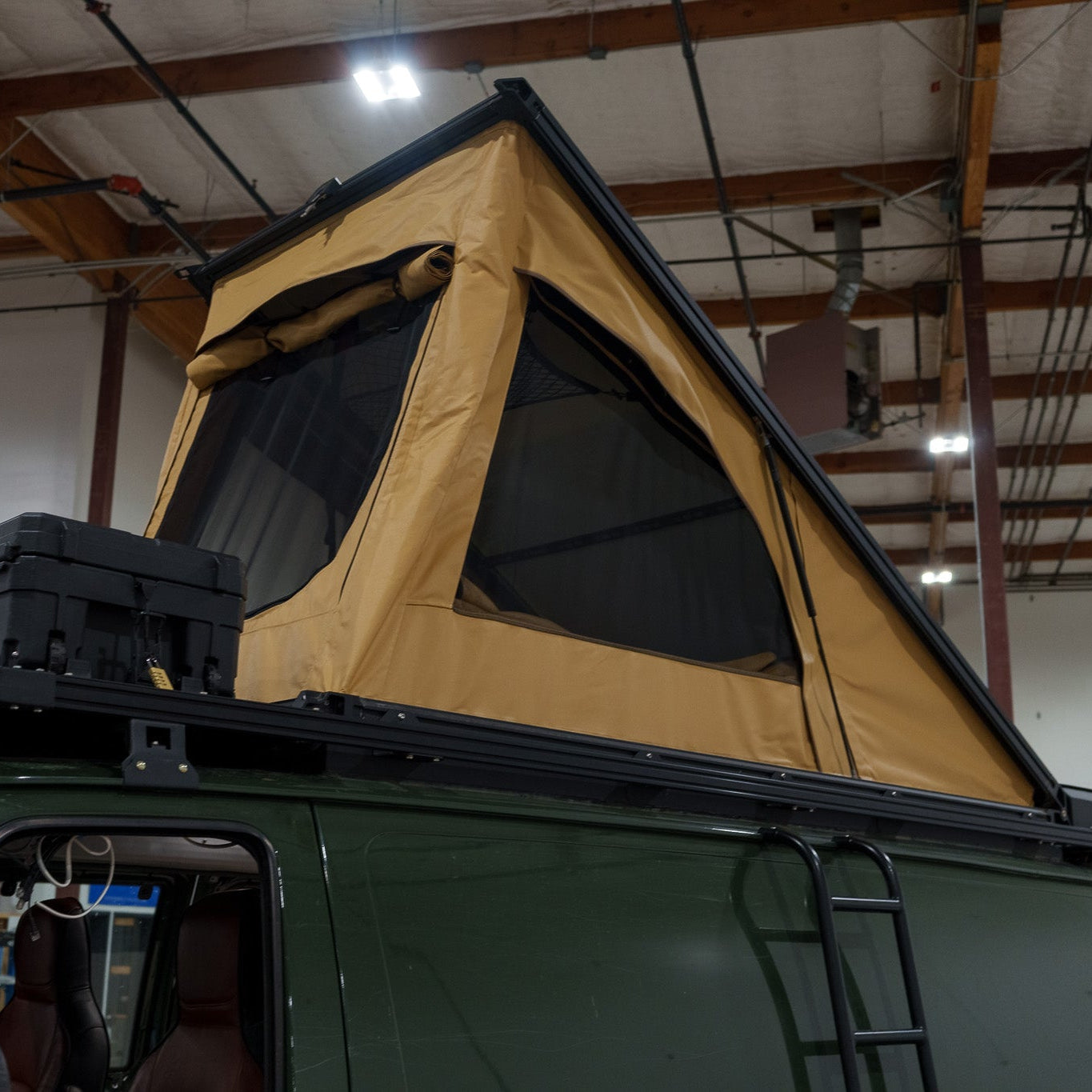 Roof top tent attached to a Ford E-Series campervan