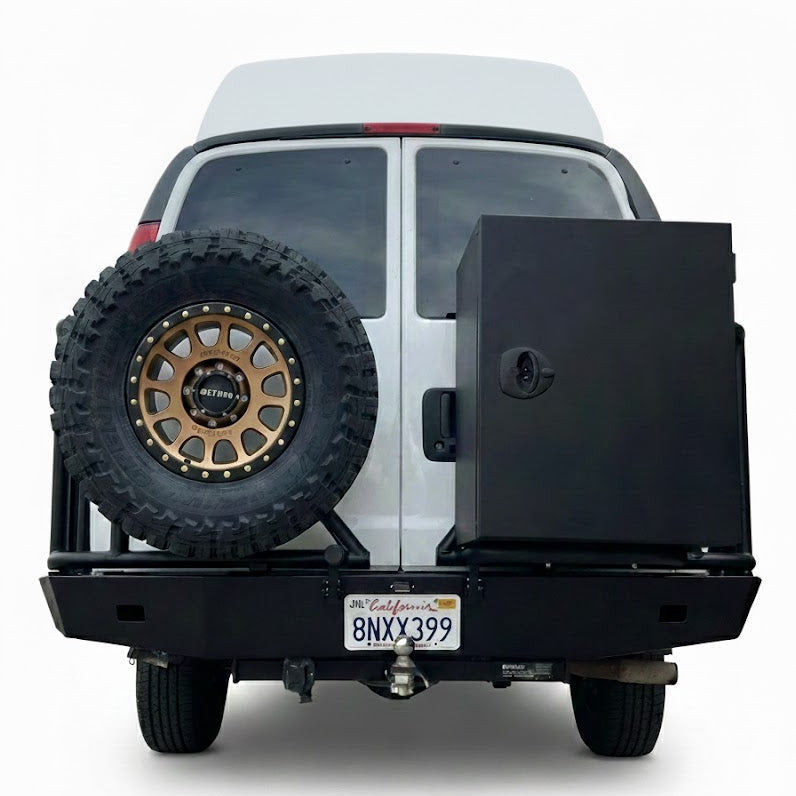 Aluminess rear bumper with swing arms, spare tire mount and storage box installed on Chevy Express van, studio white background.