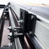 Close-up of quick-release mechanism on awning brackets for Chevy Astro vans